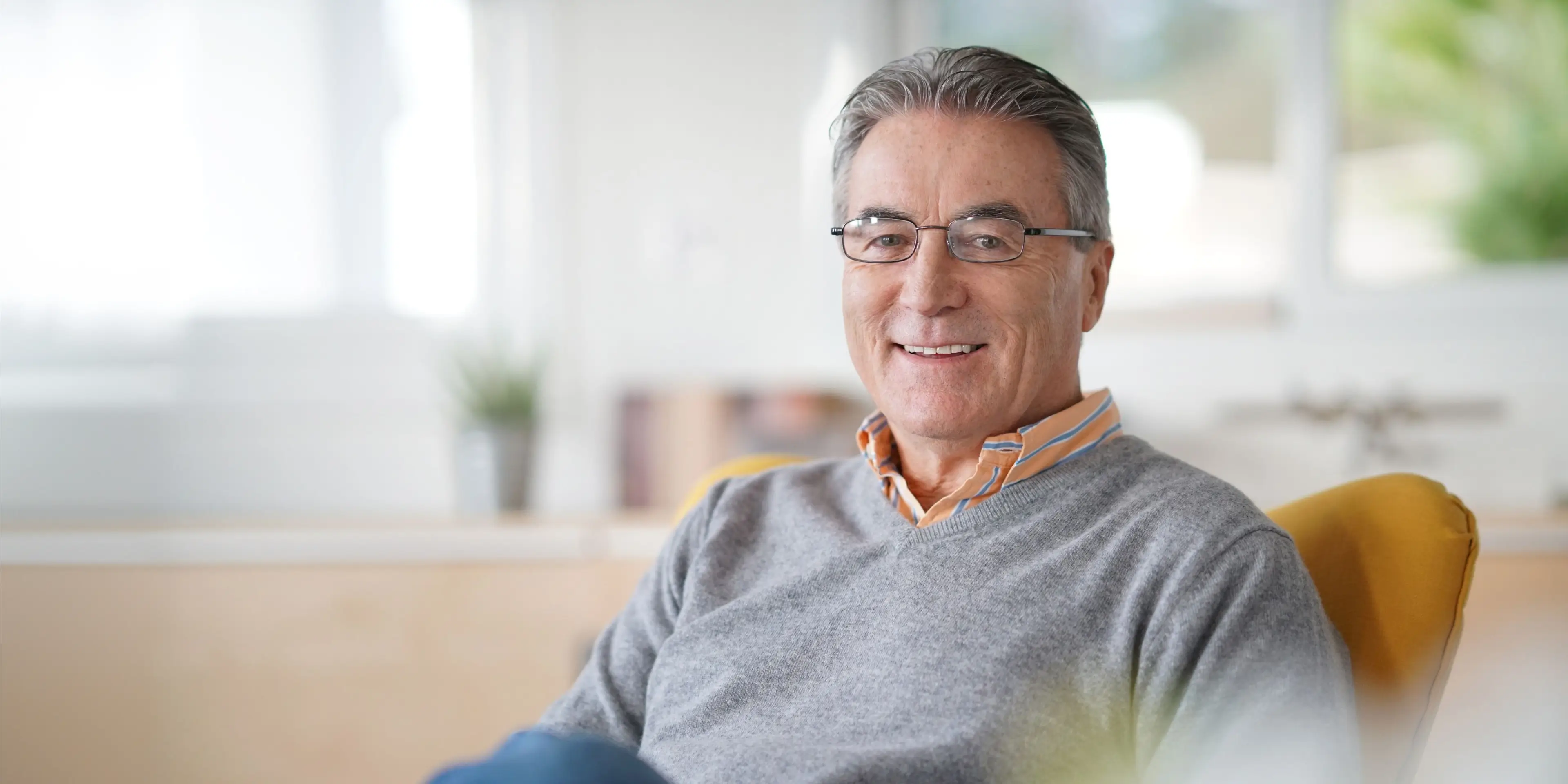 A smiling senior patient at Sunrise Dental in Richardson, TX